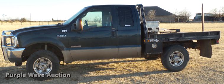 image for item EI9541 2004 Ford F250 Super Duty SuperCab bale bed pickup truck