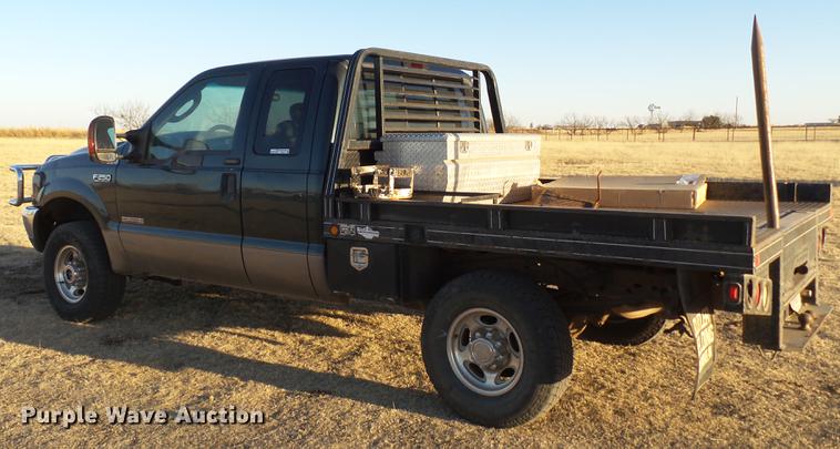 image for item EI9541 2004 Ford F250 Super Duty SuperCab bale bed pickup truck