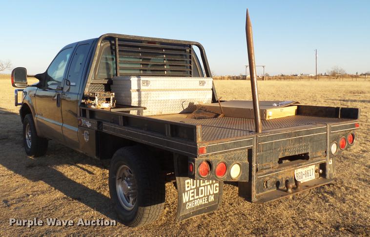 image for item EI9541 2004 Ford F250 Super Duty SuperCab bale bed pickup truck