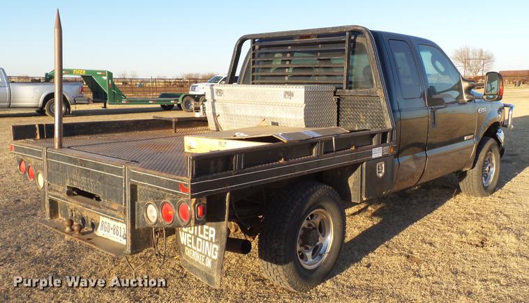 image for item EI9541 2004 Ford F250 Super Duty SuperCab bale bed pickup truck