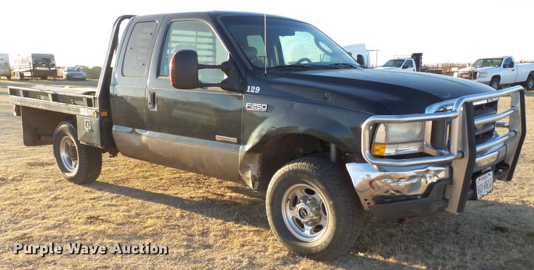 image for item EI9541 2004 Ford F250 Super Duty SuperCab bale bed pickup truck