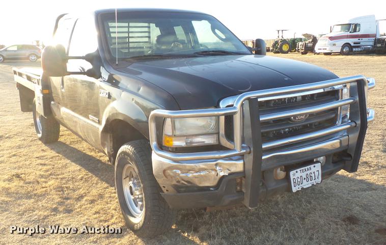 image for item EI9541 2004 Ford F250 Super Duty SuperCab bale bed pickup truck