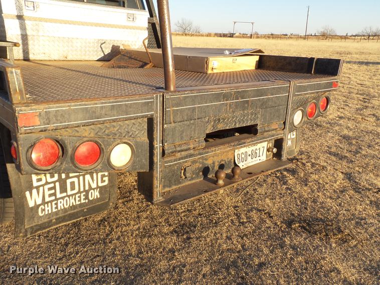 image for item EI9541 2004 Ford F250 Super Duty SuperCab bale bed pickup truck