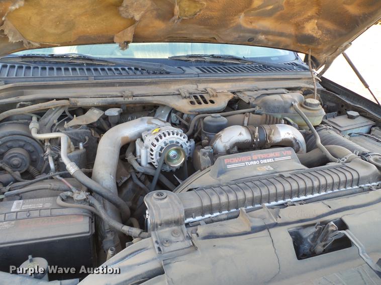 image for item EI9541 2004 Ford F250 Super Duty SuperCab bale bed pickup truck