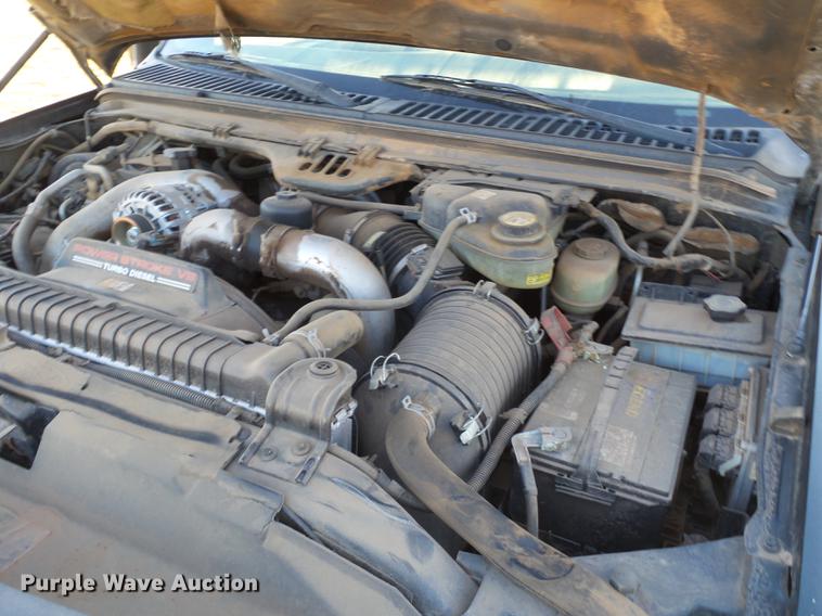 image for item EI9541 2004 Ford F250 Super Duty SuperCab bale bed pickup truck