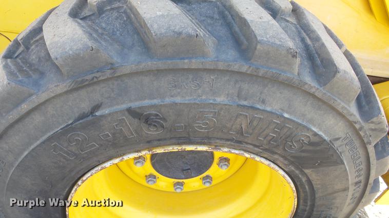 image for item EH9019 2000 John Deere 250 skid steer