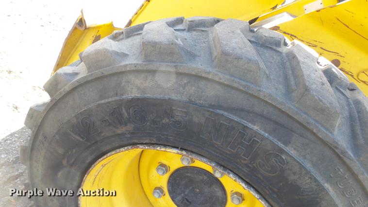 image for item EH9019 2000 John Deere 250 skid steer