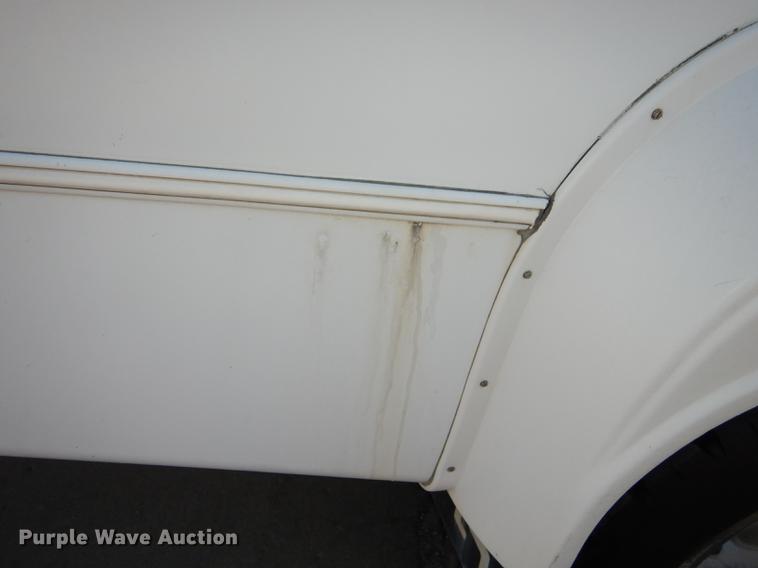 image for item DC0295 2000 Ford Econoline E350 Super Duty Goshen Coach shuttle bus