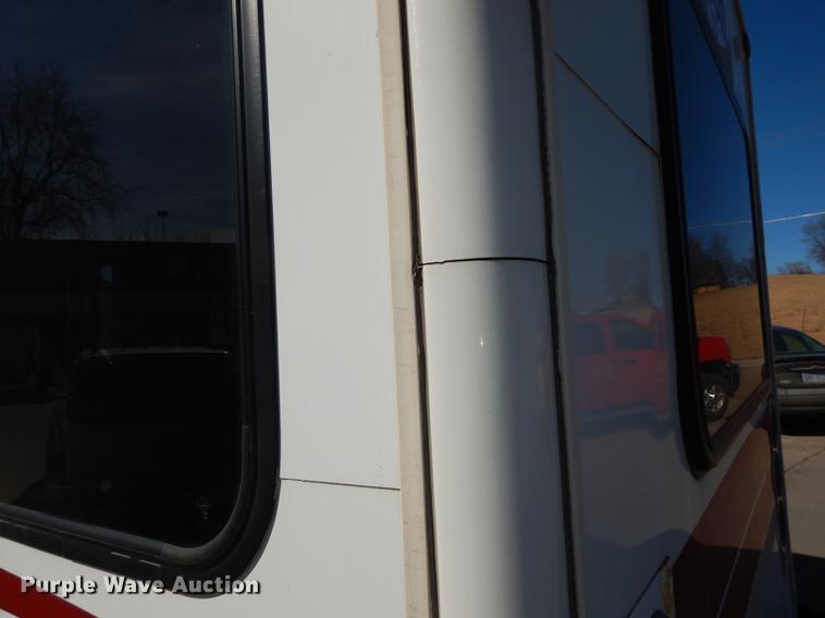 image for item DC0295 2000 Ford Econoline E350 Super Duty Goshen Coach shuttle bus