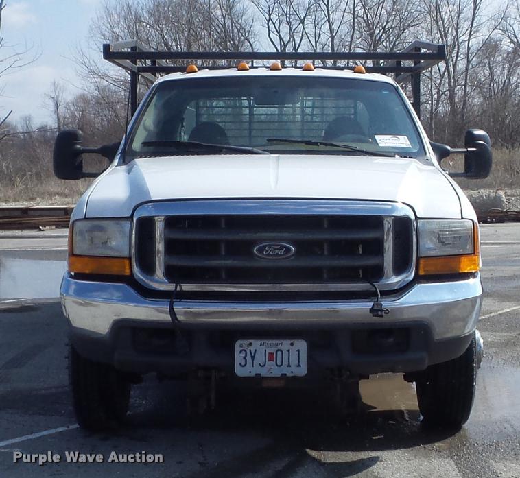 image for item DC7393 1999 Ford F350 Super Duty Lariat Crew Cab flatbed pickup truck