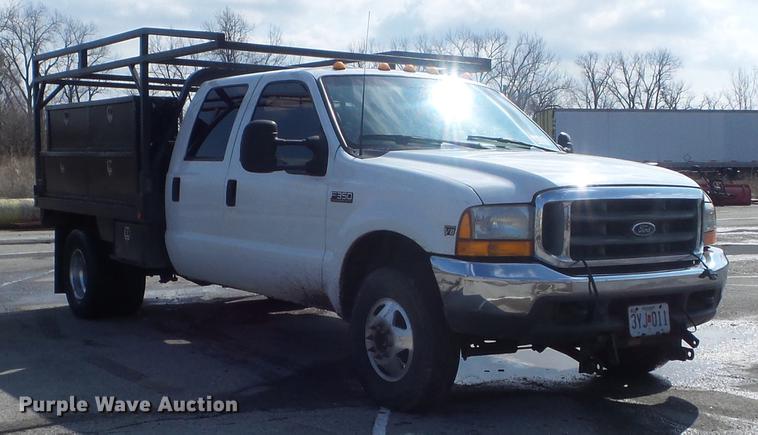 image for item DC7393 1999 Ford F350 Super Duty Lariat Crew Cab flatbed pickup truck