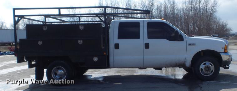 image for item DC7393 1999 Ford F350 Super Duty Lariat Crew Cab flatbed pickup truck