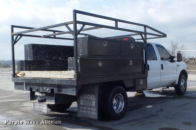 image for item DC7393 1999 Ford F350 Super Duty Lariat Crew Cab flatbed pickup truck