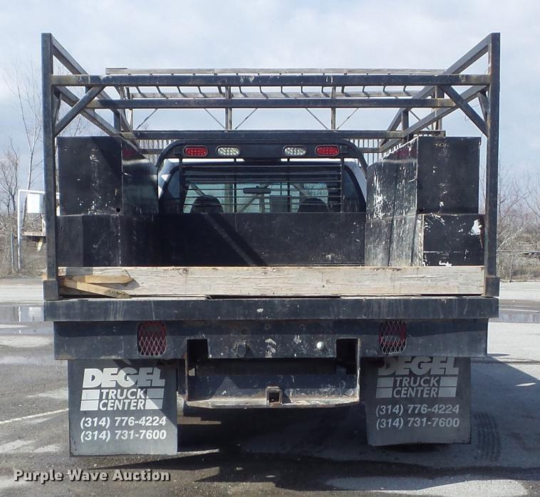 image for item DC7393 1999 Ford F350 Super Duty Lariat Crew Cab flatbed pickup truck