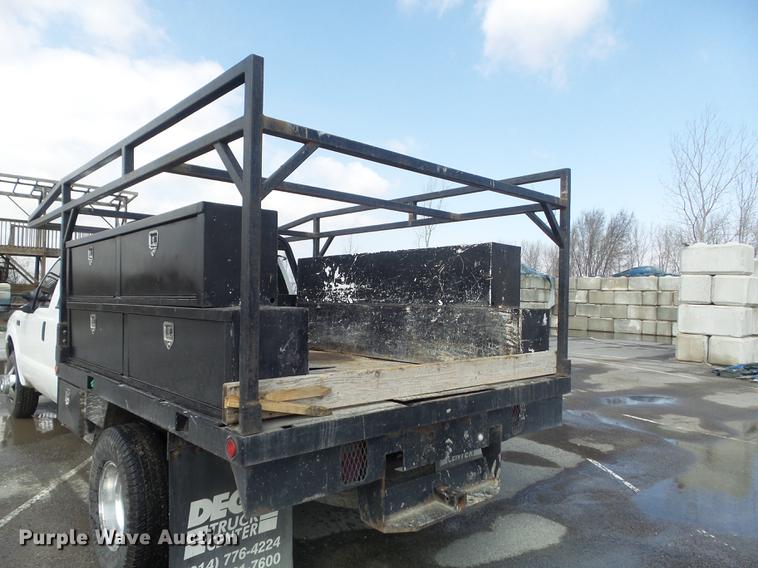 image for item DC7393 1999 Ford F350 Super Duty Lariat Crew Cab flatbed pickup truck