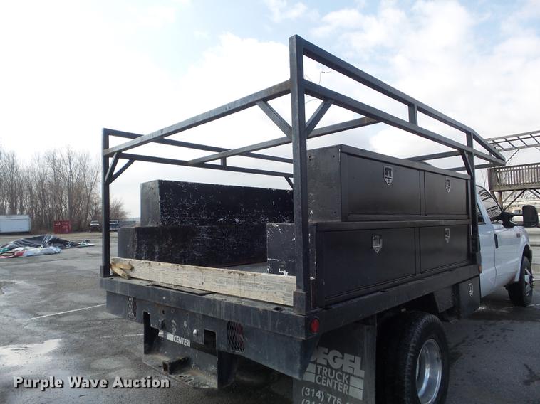 image for item DC7393 1999 Ford F350 Super Duty Lariat Crew Cab flatbed pickup truck