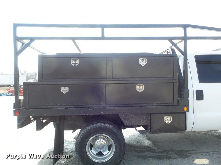 image for item DC7393 1999 Ford F350 Super Duty Lariat Crew Cab flatbed pickup truck