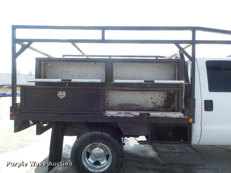 image for item DC7393 1999 Ford F350 Super Duty Lariat Crew Cab flatbed pickup truck