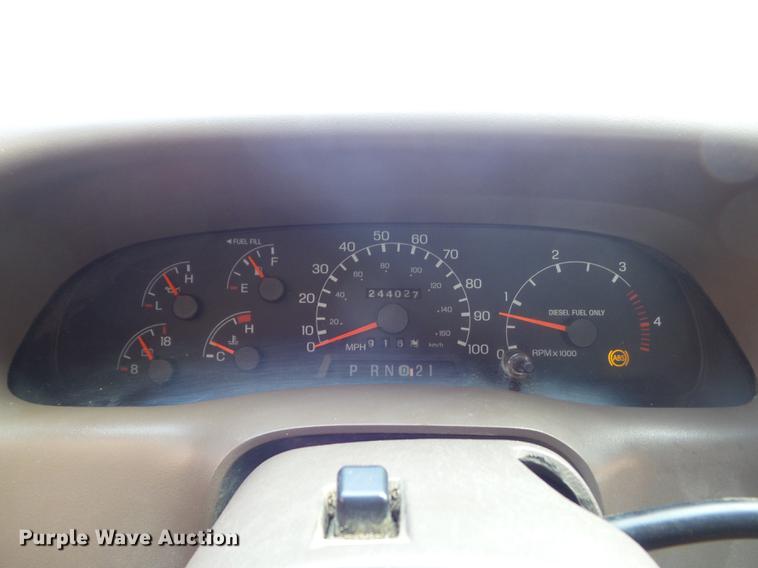 image for item DC7393 1999 Ford F350 Super Duty Lariat Crew Cab flatbed pickup truck