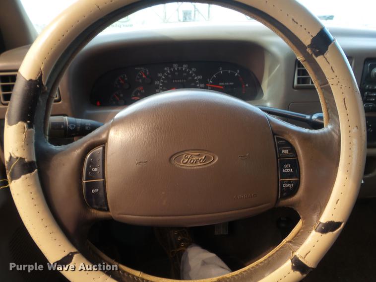 image for item DC7393 1999 Ford F350 Super Duty Lariat Crew Cab flatbed pickup truck