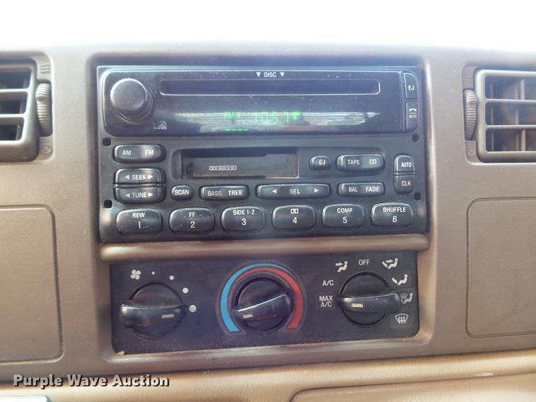 image for item DC7393 1999 Ford F350 Super Duty Lariat Crew Cab flatbed pickup truck