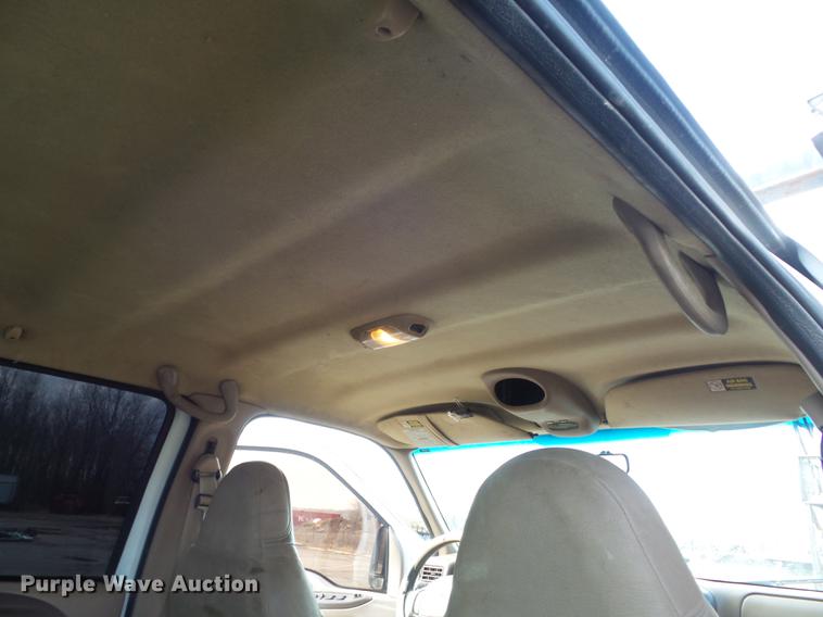 image for item DC7393 1999 Ford F350 Super Duty Lariat Crew Cab flatbed pickup truck