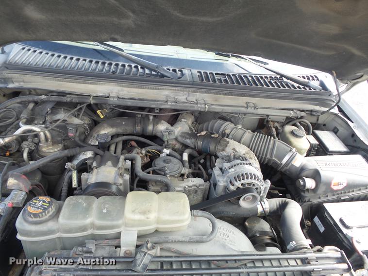 image for item DC7393 1999 Ford F350 Super Duty Lariat Crew Cab flatbed pickup truck