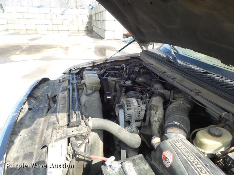 image for item DC7393 1999 Ford F350 Super Duty Lariat Crew Cab flatbed pickup truck