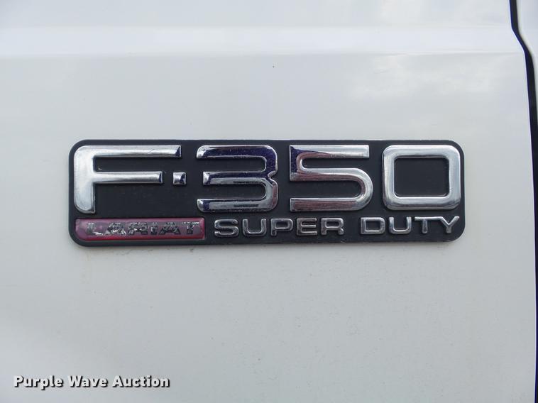 image for item DC7393 1999 Ford F350 Super Duty Lariat Crew Cab flatbed pickup truck
