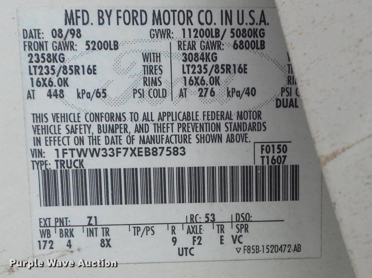 image for item DC7393 1999 Ford F350 Super Duty Lariat Crew Cab flatbed pickup truck