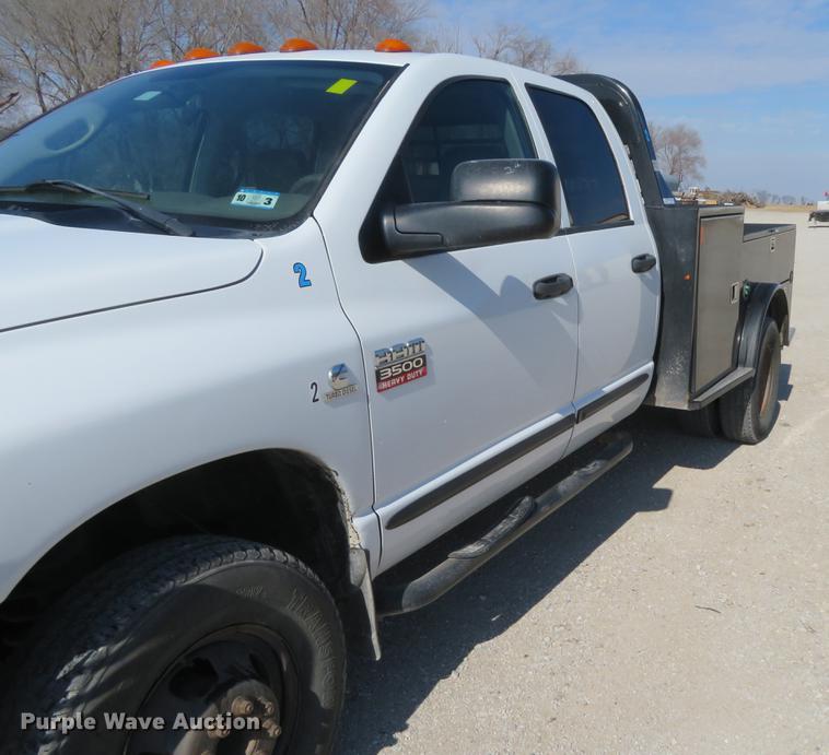 image for item DF9877 2007 Dodge Ram 3500 Quad Cab flatbed pickup truck