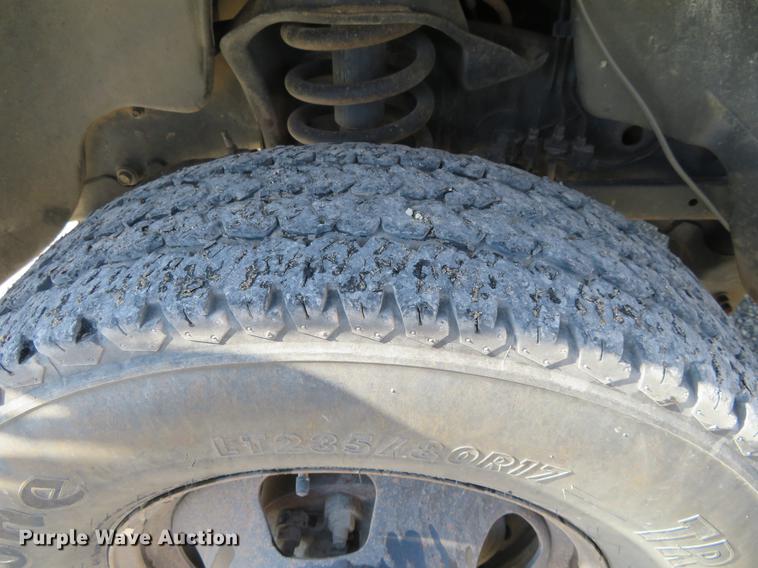 image for item DF9877 2007 Dodge Ram 3500 Quad Cab flatbed pickup truck