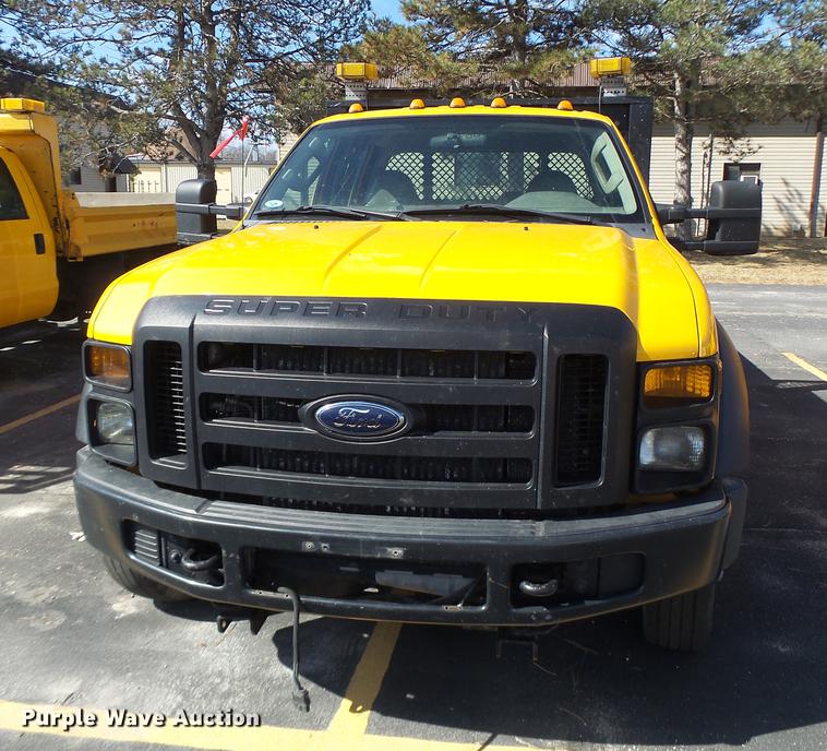 image for item DC4417 2008 Ford F550 Crew Cab flatbed dump truck