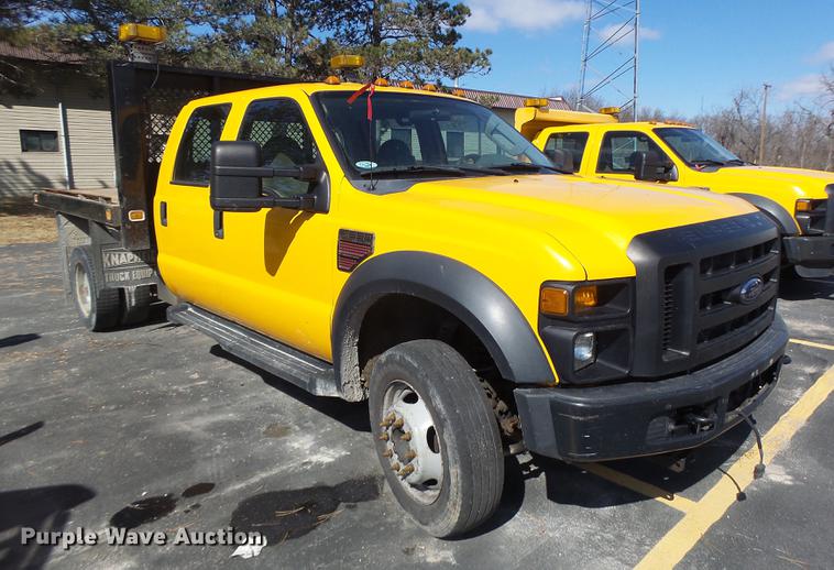 image for item DC4417 2008 Ford F550 Crew Cab flatbed dump truck