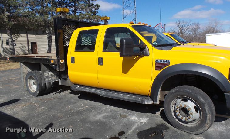image for item DC4417 2008 Ford F550 Crew Cab flatbed dump truck