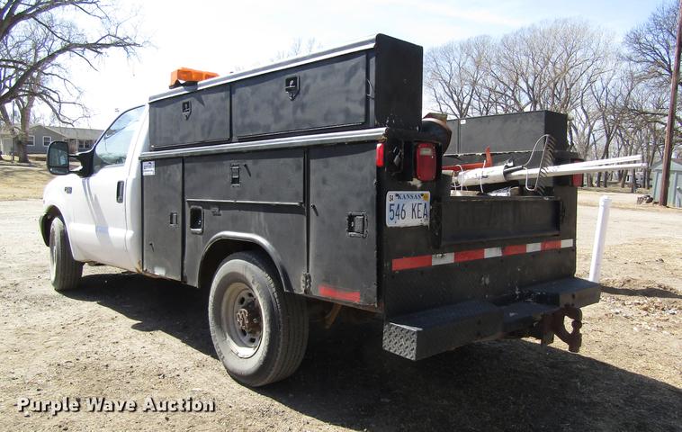 image for item DD8734 1999 Ford F250 Super Duty utility bed pickup truck