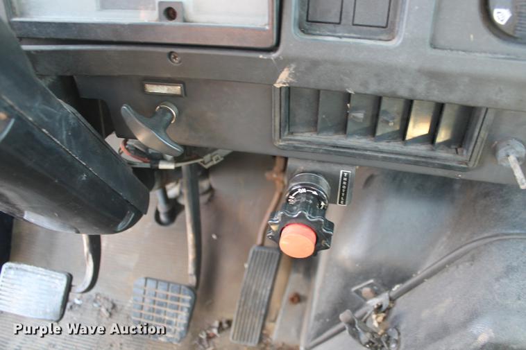 image for item DB5132 1996 International 4700 truck with Vermeer tree spade