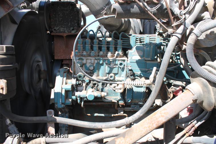 image for item DB5132 1996 International 4700 truck with Vermeer tree spade