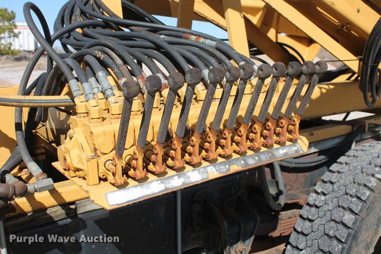 image for item DB5132 1996 International 4700 truck with Vermeer tree spade