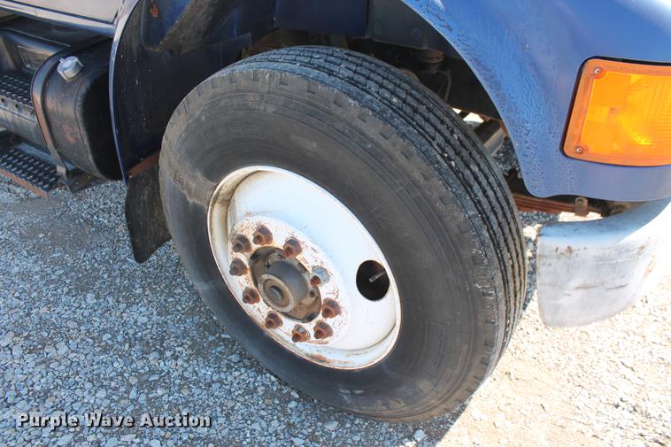 image for item DB5132 1996 International 4700 truck with Vermeer tree spade