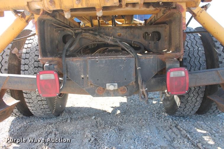 image for item DB5132 1996 International 4700 truck with Vermeer tree spade