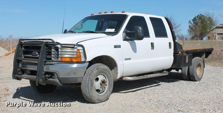 image for item DB5143 2001 Ford F350 Super Duty XL Crew Cab flatbed pickup truck