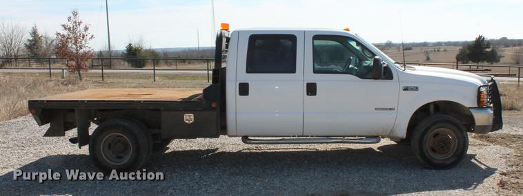 image for item DB5143 2001 Ford F350 Super Duty XL Crew Cab flatbed pickup truck