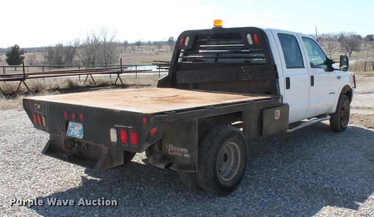 image for item DB5143 2001 Ford F350 Super Duty XL Crew Cab flatbed pickup truck