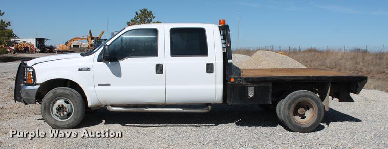 image for item DB5143 2001 Ford F350 Super Duty XL Crew Cab flatbed pickup truck