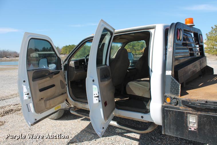 image for item DB5143 2001 Ford F350 Super Duty XL Crew Cab flatbed pickup truck