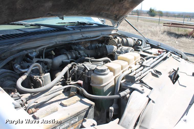 image for item DB5143 2001 Ford F350 Super Duty XL Crew Cab flatbed pickup truck