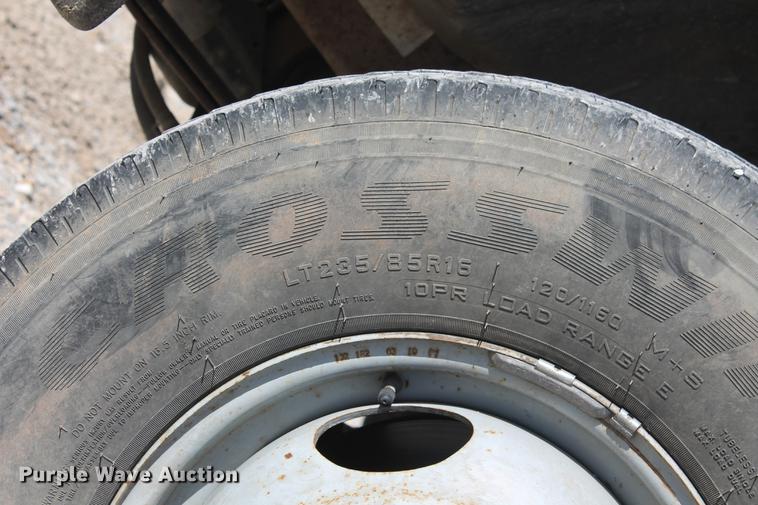 image for item DB5143 2001 Ford F350 Super Duty XL Crew Cab flatbed pickup truck