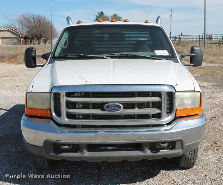 image for item DB5144 1999 Ford F350 Super Duty XLT SuperCab flatbed pickup truck