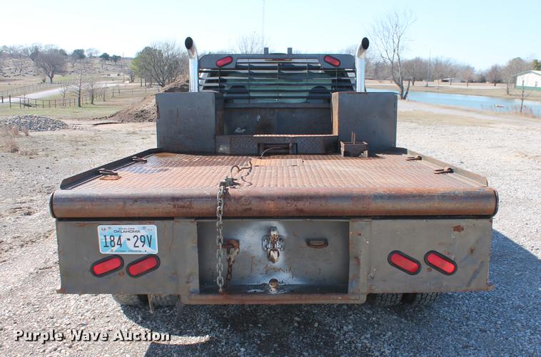 image for item DB5144 1999 Ford F350 Super Duty XLT SuperCab flatbed pickup truck